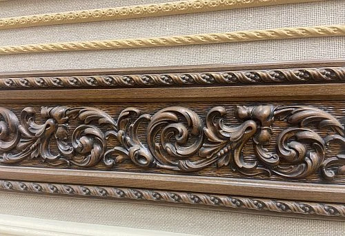 Close-up of carved wooden molding with detailed ornament