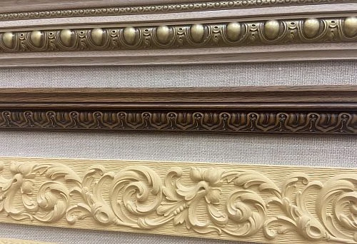 Various wooden moldings with carved ornamentation and decorative elements