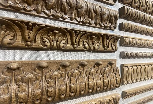 Collection of wooden decorative elements designed for framing and interior decoration