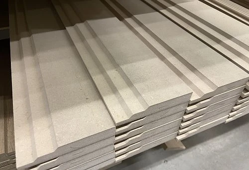 MDF skirting board blanks for painting, neatly stacked on top of each other