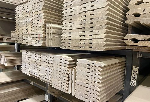 Warehouse with MDF baseboards neatly arranged on shelves