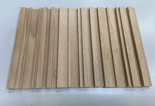 Photograph of wooden planks with vertical relief, highlighting natural wood texture and color.