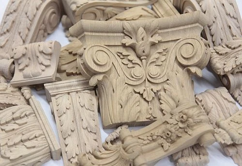 Carved wooden decorative elements for interior finishing, creating an elegant and refined style