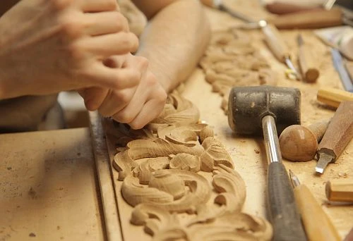Wood Carving in Workshop &ndash; Handcrafted by Master for Creating Exclusive Decorative Elements.