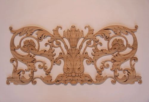 Wooden overlay decoration with symmetrical ornament