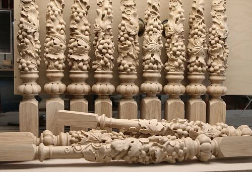 Carved balusters from solid wood with three-dimensional decorative elements,