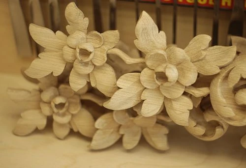 Carved wooden element with floral motifs, executed in relief carving, perfectly suited for interior decoration