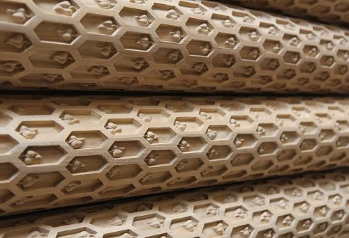 Wooden columns with geometric ornament &ndash; interior decor