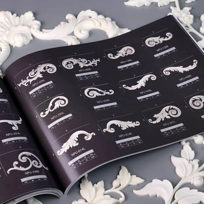 Open glossy STAVROS catalog with interior photos of polyurethane decor in classical style &mdash; moldings and wall plasterwork