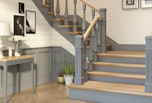 Staircase to the second floor with wooden railings and decorative elements.