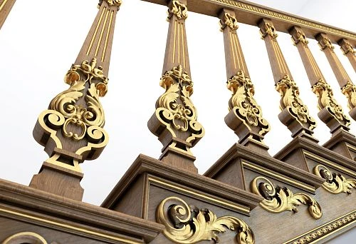 Luxurious carved balusters with gold plating and decorative finish, securely mounted on the stair base