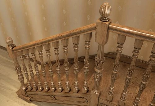 Classic wooden balusters on the staircase in the interior of a private house, carved ornament