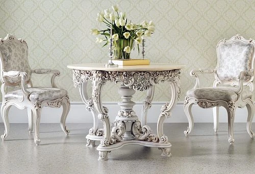 Luxurious wooden table with carved base and two classic chairs in a light interior