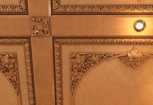 Wall panels made of natural wood with artistic carving in a classic style