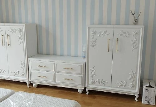 Elegant furniture set in classic style with decorative elements.