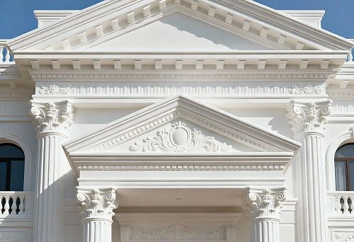 Architectural facade decor with columns, cornices, and pediments in classical style