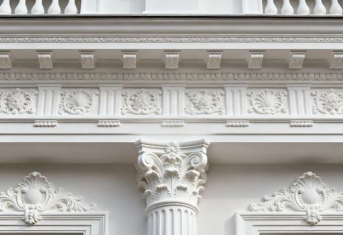 Facade Decor St. Petersburg with Column and Carved Elements on White Building Facade