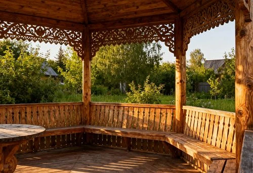 Wooden Gazebo in Russian Style with Slatted Railings and Carved Frieze Against a Green Garden Backdrop