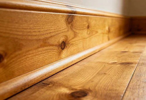 Wide Solid Wood Baseboard with Natural Texture in Interior