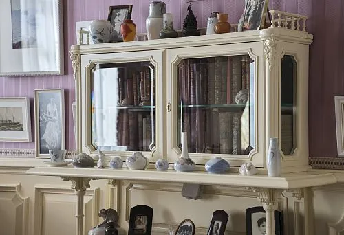 Luxurious Bookcase with Gilded Elements and Stained Glass Inserts