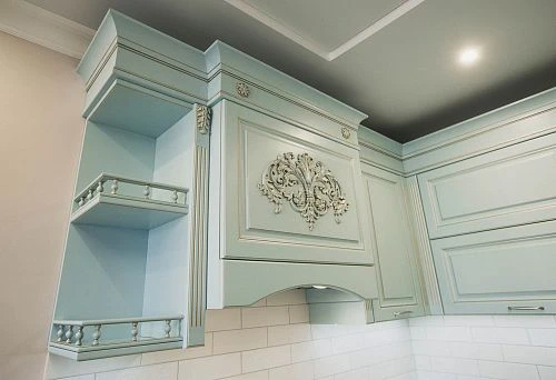 Elegant furniture set with refined details and carved fronts.