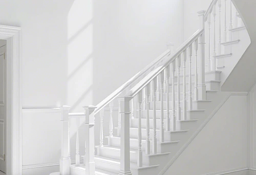 Modern staircase with white balusters and handrails in a light interior