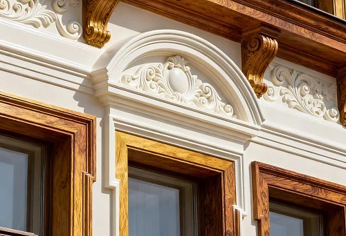 Facade decor for exterior windows with carved elements and wooden frames