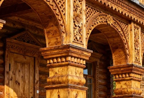 Carved Wooden Facade Elements with Arches and Columns in House Architecture