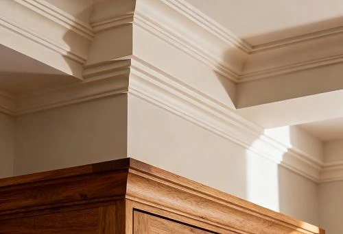 Combination of wooden and polyurethane cornice on the wall