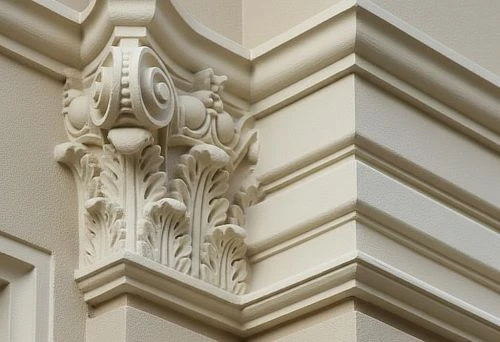 Molded corner element for building facade design