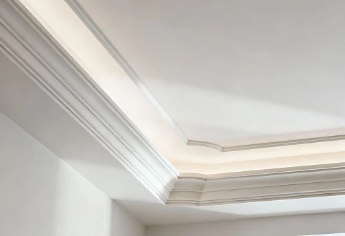 Ceiling cornices made of phytopolymer with soft lighting and even joints in a modern interior