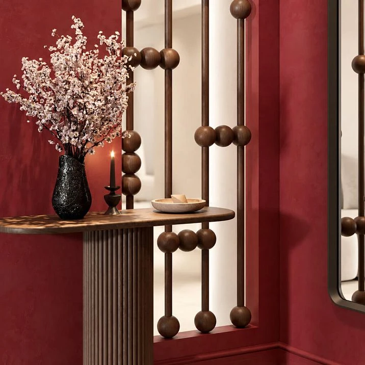 Interior partition with spherical elements, wide-angle view of the hallway area in burgundy tones.