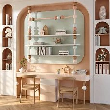Shelving unit for the children's room with round elements and three shelves, built into an arched niche above the desk.