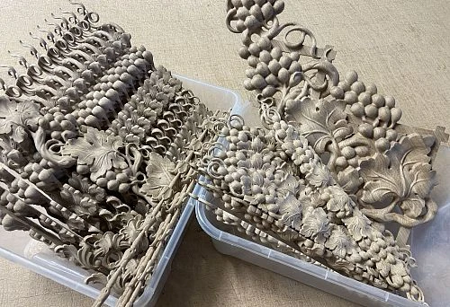 Carved decorative wooden ornaments with grapevine pattern