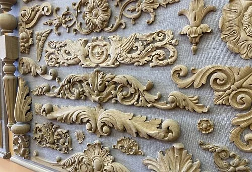 Collection of decorative carved wooden ornaments for interiors