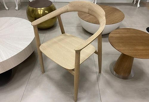Modern chair and designer tables in the Italian furniture salon