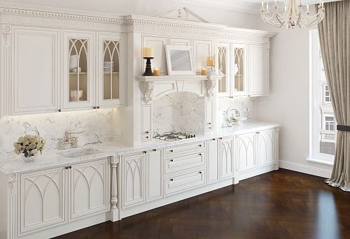 Classic solid wood kitchen with carved decoration, stained glass fronts, and marble countertop