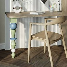 Black and white furniture leg KON-011 in a modern workspace interior