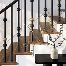 Black balusters KON-013 with rounded and golden elements in stair railing