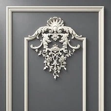 CPU-5-2 top decor close-up: Baroque ornament with scrolls, a shell, and floral motifs against a classic frame
