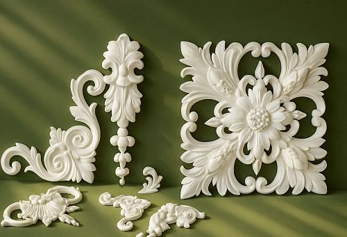 White Molding with Carved Decorative Elements and Floral Patterns on a Green Wall