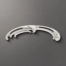 Sculptural decoration NPU-426R up close, showing smooth arch-like lines and scrolls