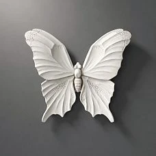 Molded decor NPU-479 from polyurethane in the form of a white butterfly, close-up
