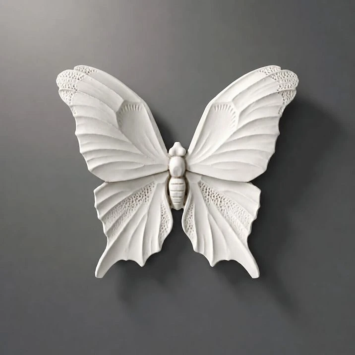 Molded decor NPU-479 from polyurethane in the form of a white butterfly, close-up
