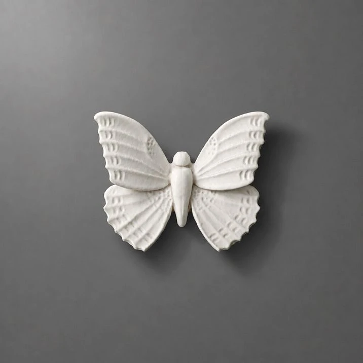 NPU-481 molding in the form of a white butterfly on a gray background.