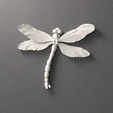Molded decoration NPU-485 Dragonfly from white polyurethane on a gray background.