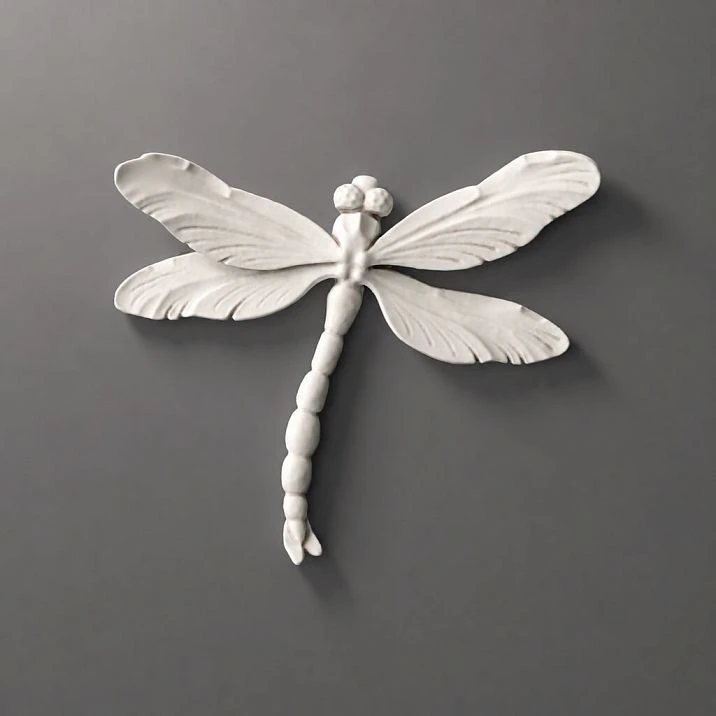 Molded decoration NPU-485 Dragonfly from white polyurethane on a gray background.