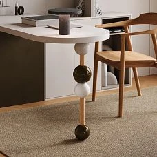 Decorative partition with wooden spheres in the hallway, general view of the interior with a console and mirror.