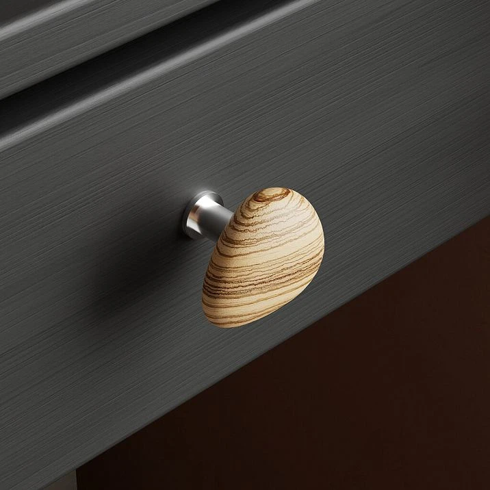 Pebble HL-065-2M furniture handle made of walnut with white oil, in a pebble shape for kitchen fronts, cabinets, and dressers