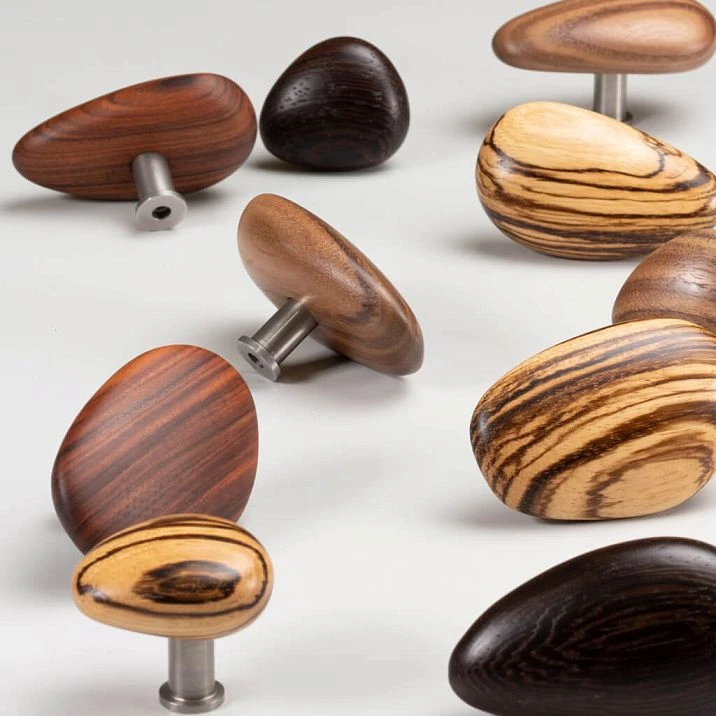 Pebble HL-065-2M handle made of walnut with white oil, in a streamlined pebble shape for children's furniture, shelves, and stylish cabinets